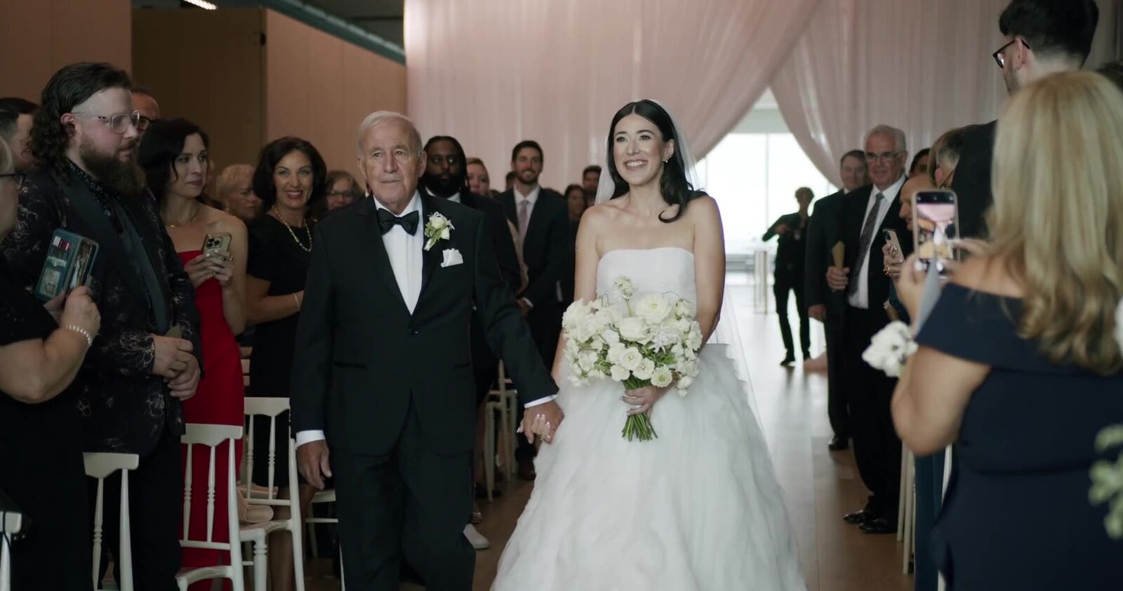 A father walking his daughter down the aisle